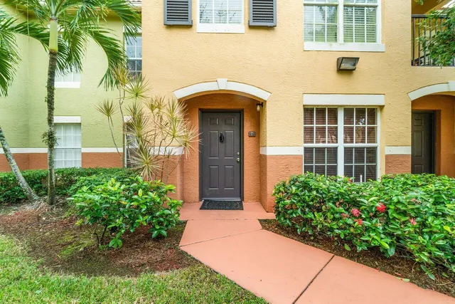front view of a house with a garden