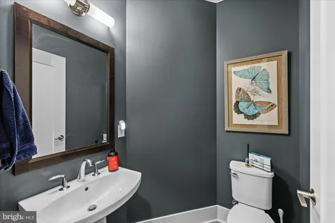 a bathroom with a double vanity sink a mirror and a shower