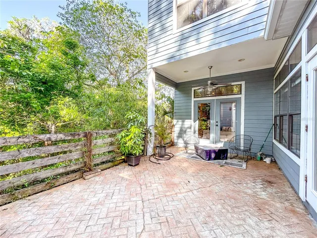 a view of a chairs and fire pit in backyard of the house