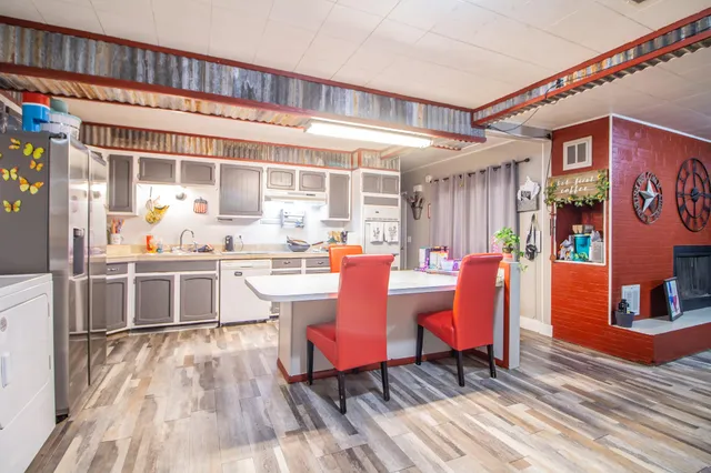 a dinning table and chairs in a patio