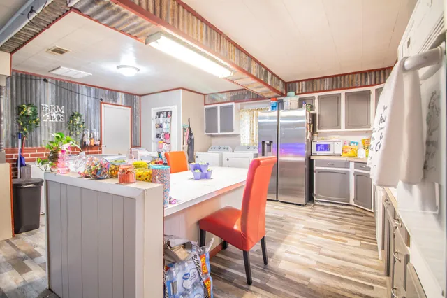 a view of a dining room with furniture and a window