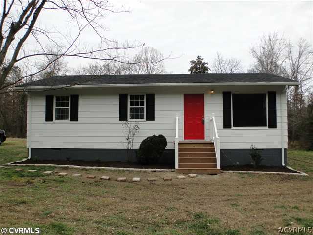 235 Wakema Road West Point, VA 23181 - Photo 1 of 9 a view of a house with a yard