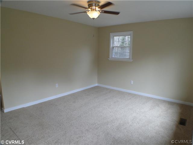 235 Wakema Road West Point, VA 23181 - Photo 4 of 9 an empty room with a window