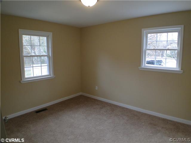 235 Wakema Road West Point, VA 23181 - Photo 5 of 9 an empty room with a window