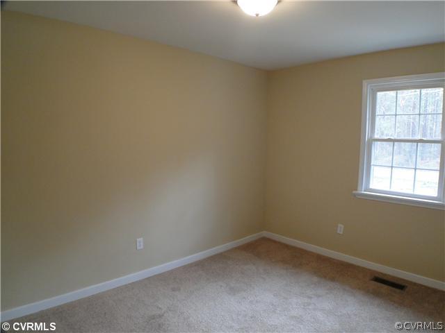 235 Wakema Road West Point, VA 23181 - Photo 6 of 9 an empty room with a window