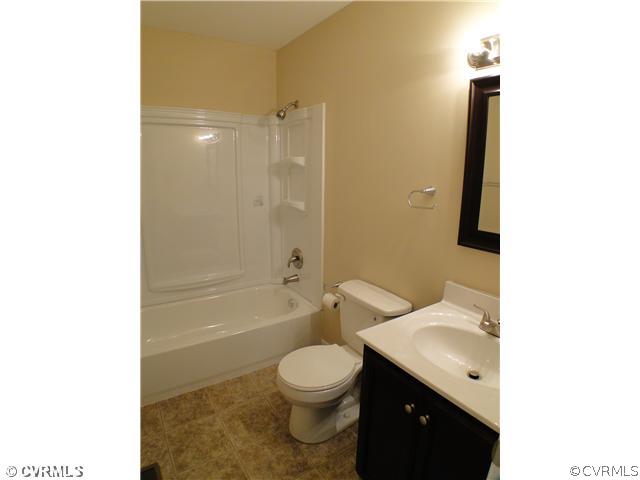 235 Wakema Road West Point, VA 23181 - Photo 7 of 9 a bathroom with a toilet a sink and bathtub