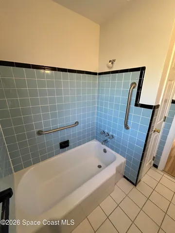 a bathroom with a toilet a sink and bathtub