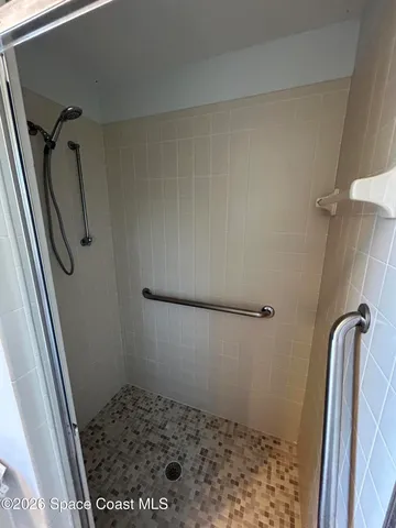 a bathroom with a sink toilet and mirror