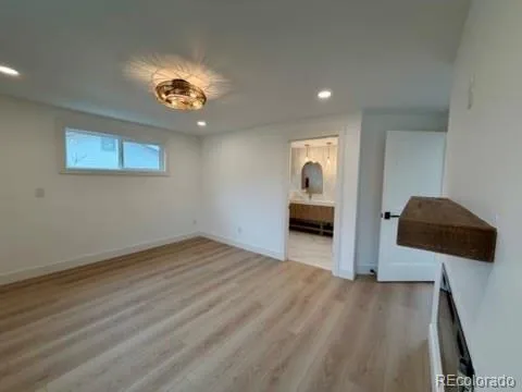 a bathroom with a tub sink mirror and shower