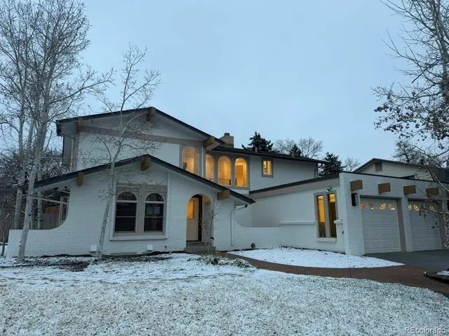 a large kitchen with a large counter top appliances and cabinets