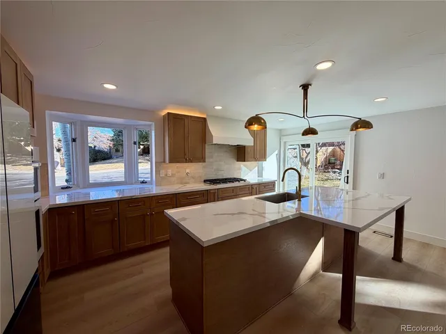 a view of a livingroom with furniture and wooden floor