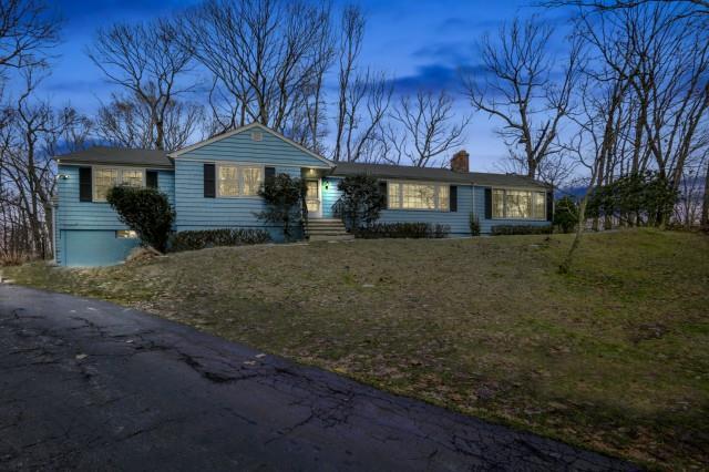 12 Hollow Spring Road Norwalk, CT 06854 - Photo 1 of 1 a front view of a house with a yard