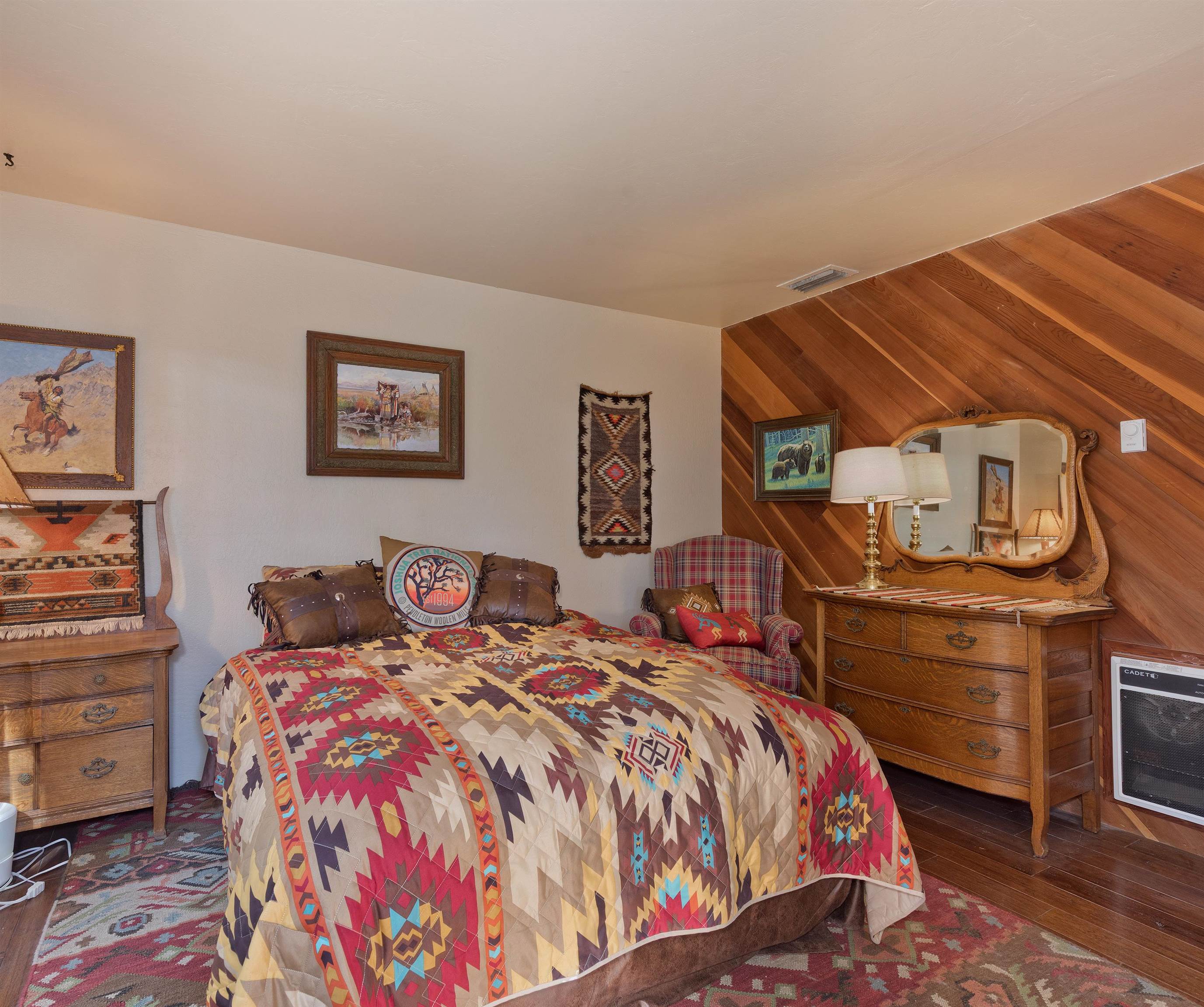 91 St Moritz Road Mammoth Lakes, CA 93546 - Photo 15 of 34 a bed sitting in a bedroom and dresser