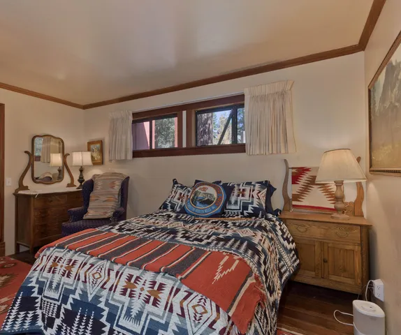 a bedroom with a bed and dresser