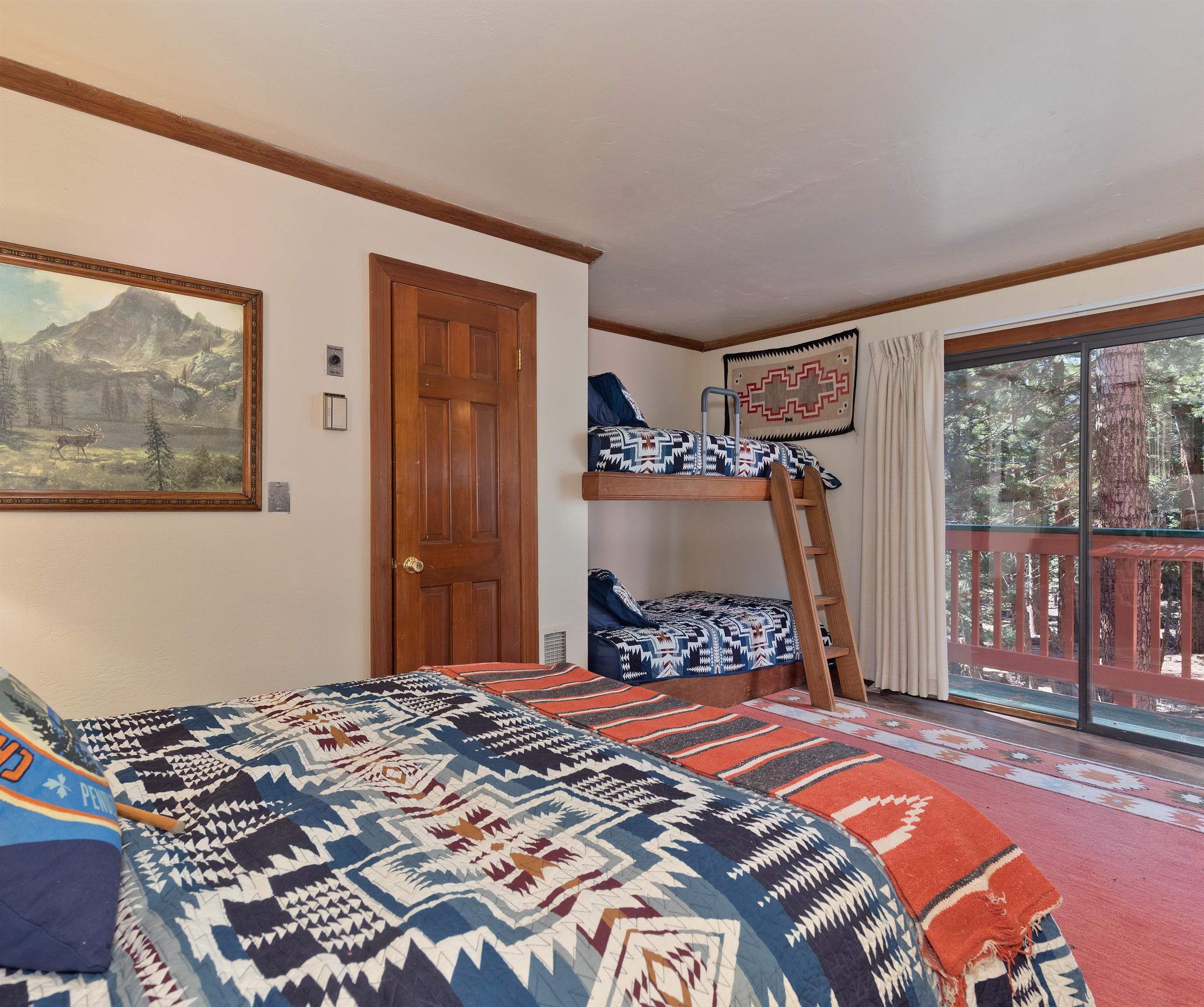 91 St Moritz Road Mammoth Lakes, CA 93546 - Photo 17 of 34 a bedroom with a bed and a window