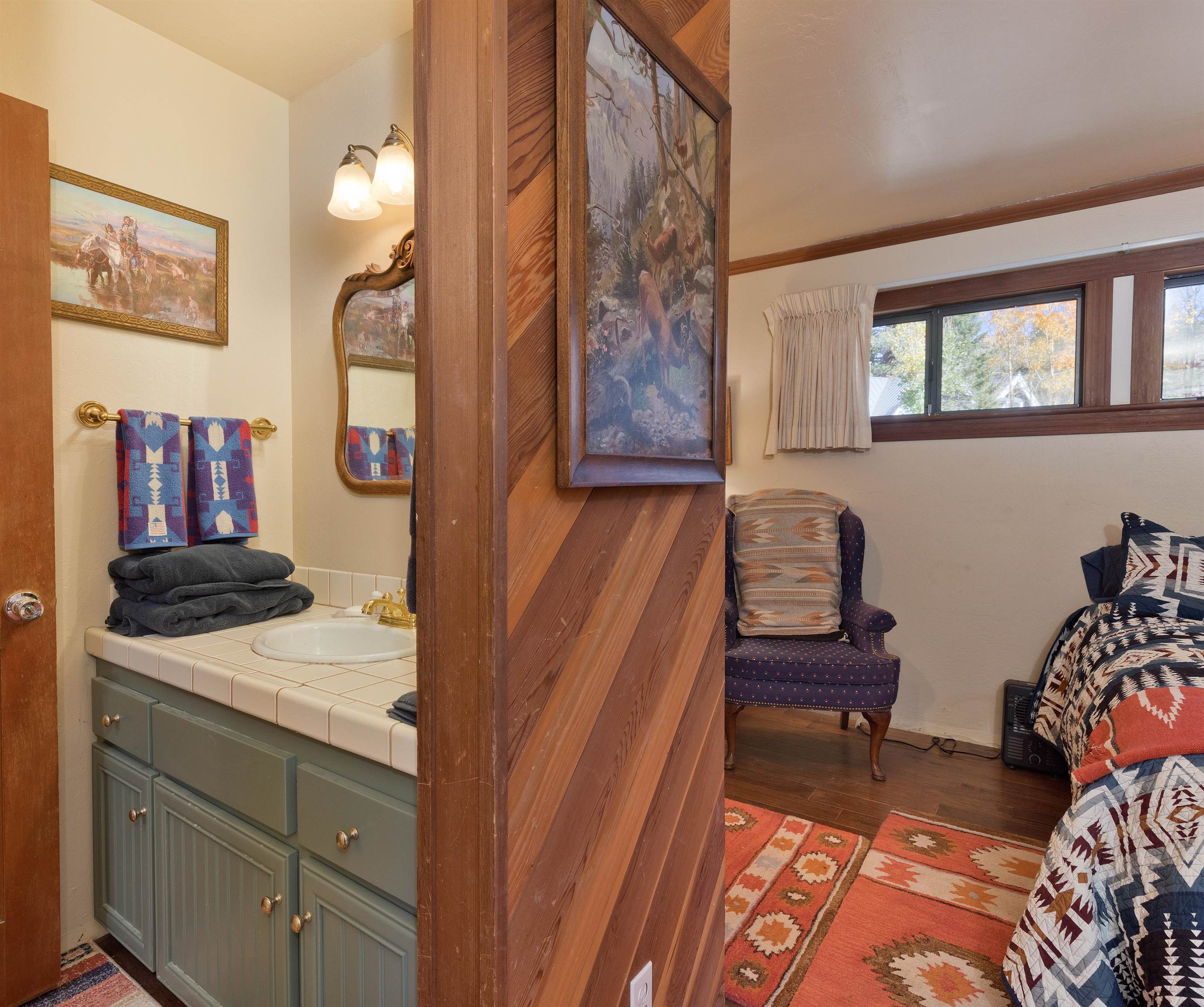 91 St Moritz Road Mammoth Lakes, CA 93546 - Photo 18 of 34 a bedroom with a bed and furniture