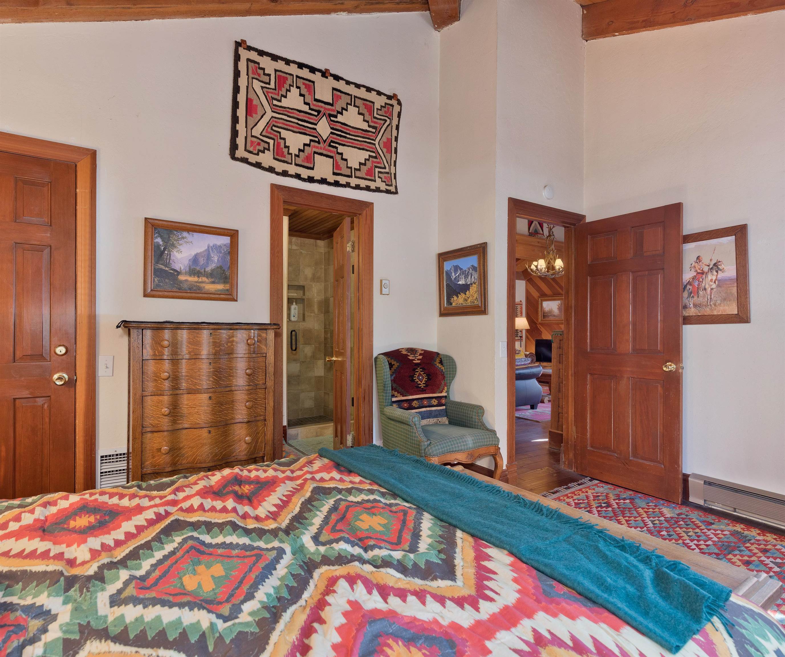 91 St Moritz Road Mammoth Lakes, CA 93546 - Photo 24 of 34 a bedroom with a bed and a dresser in it