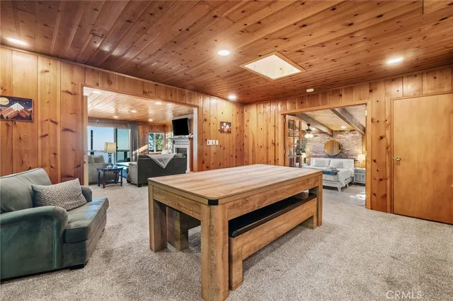 a spacious bedroom with a bed and a mirror