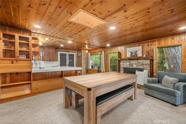 a spacious bedroom with a bed and a large kitchen