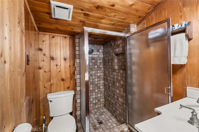 a bathroom with a toilet and shower