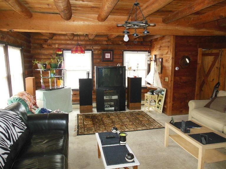 40 Daisy Hill Road Hyannis, MA 02601 - Photo 7 of 22 a living room with furniture and a fireplace