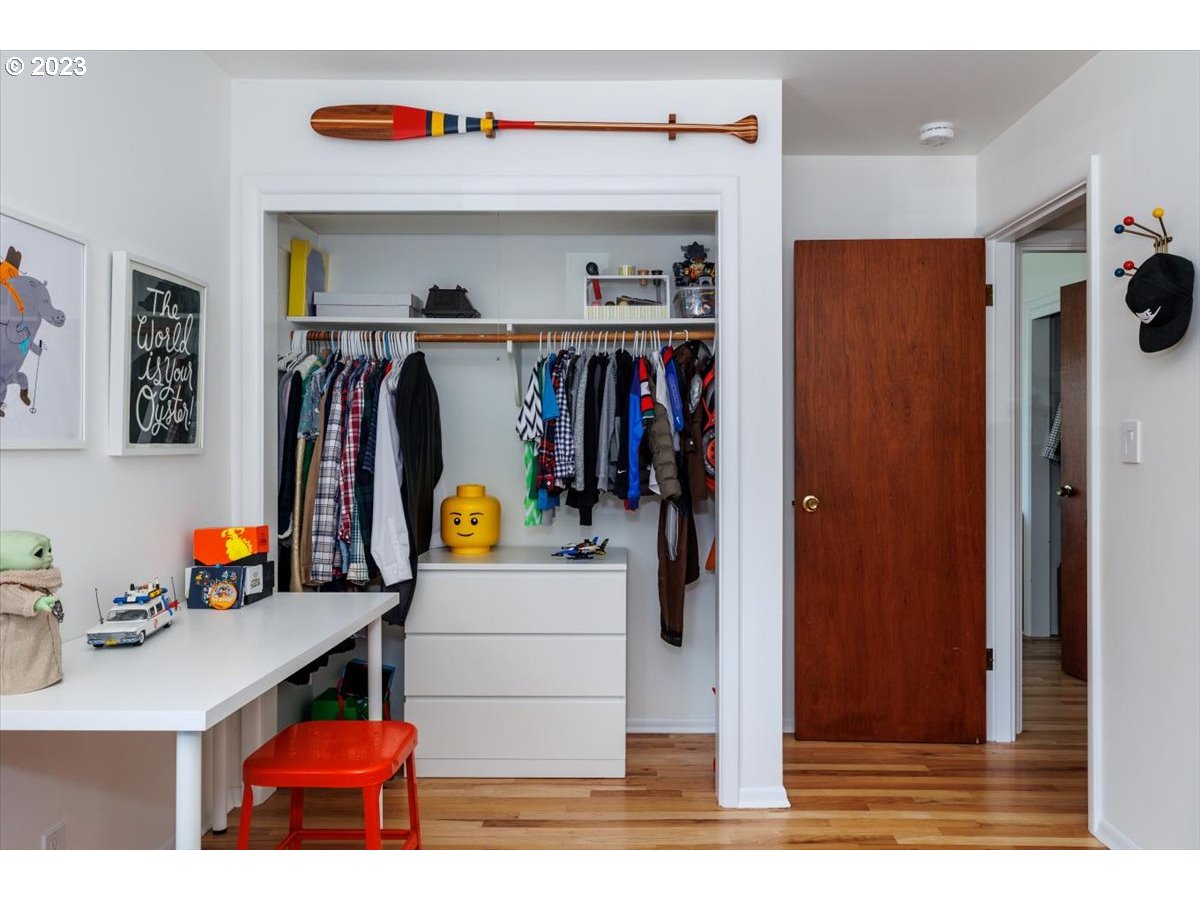 7519 Southwest 53rd Avenue Portland, OR 97219 - Photo 16 of 30 a view of walk in closet with clothes and shoes