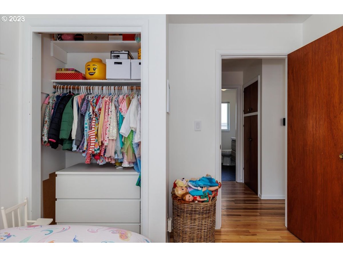 7519 Southwest 53rd Avenue Portland, OR 97219 - Photo 18 of 30 a view of a hallway with painting and stairs