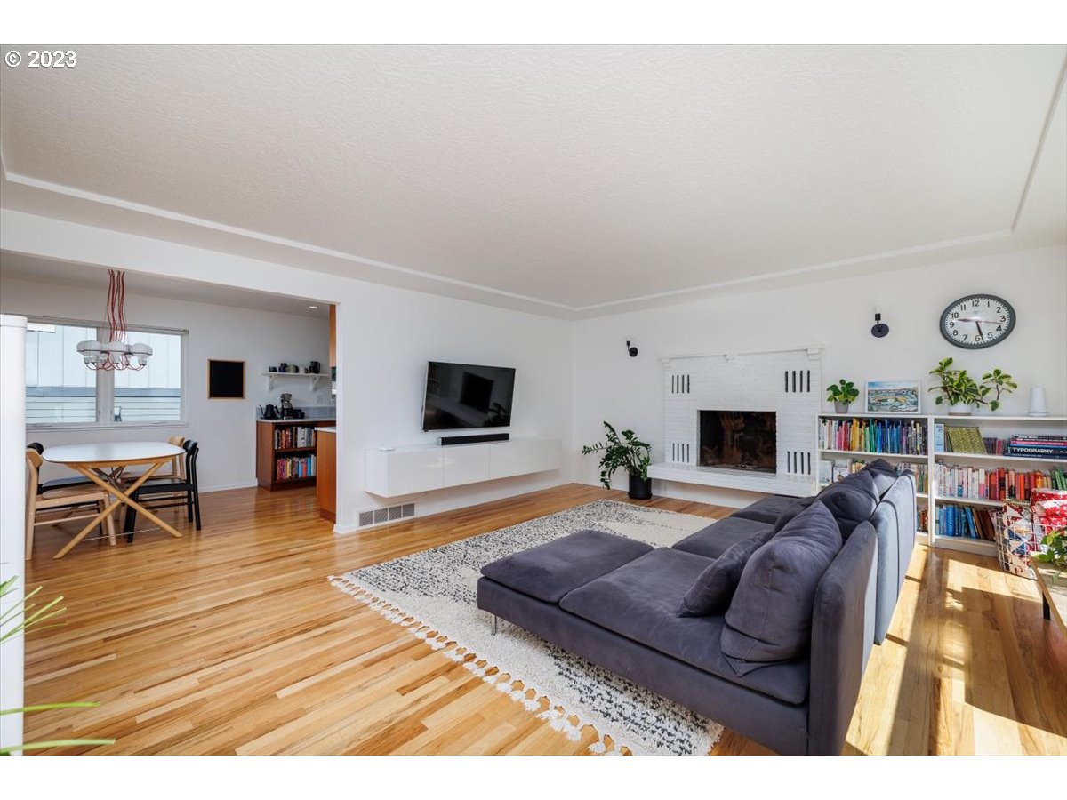 7519 Southwest 53rd Avenue Portland, OR 97219 - Photo 2 of 30 a living room with furniture flat screen tv and a table