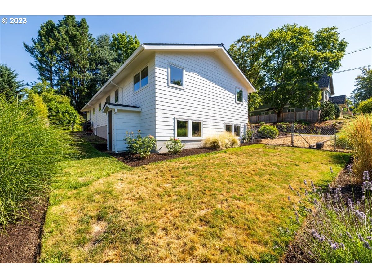 7519 Southwest 53rd Avenue Portland, OR 97219 - Photo 24 of 30 a view of a house with a yard