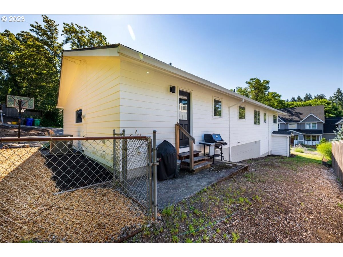 7519 Southwest 53rd Avenue Portland, OR 97219 - Photo 26 of 30 a view of a backyard with a sitting area