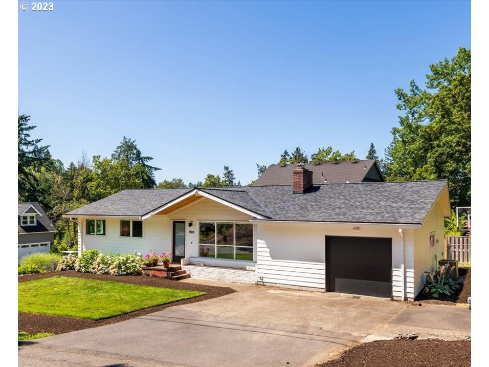 7519 Southwest 53rd Avenue Portland, OR 97219 - Photo 27 of 30 a front view of a house with yard