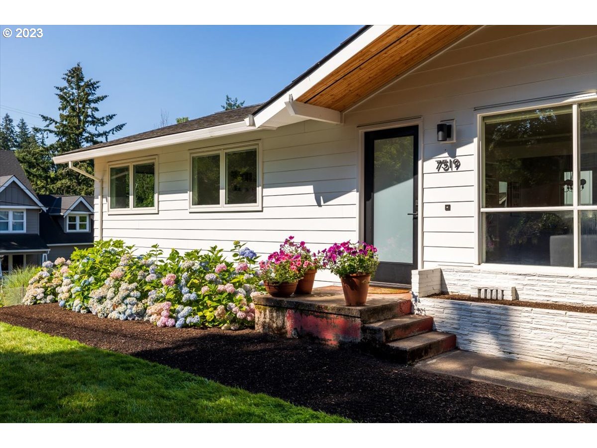 7519 Southwest 53rd Avenue Portland, OR 97219 - Photo 29 of 30 a front view of a house with a yard