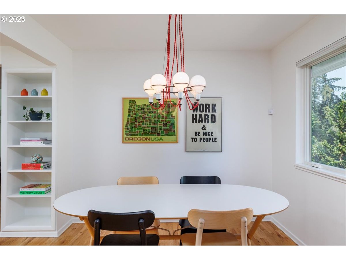 7519 Southwest 53rd Avenue Portland, OR 97219 - Photo 6 of 30 a view of a dining room with furniture and a chandelier