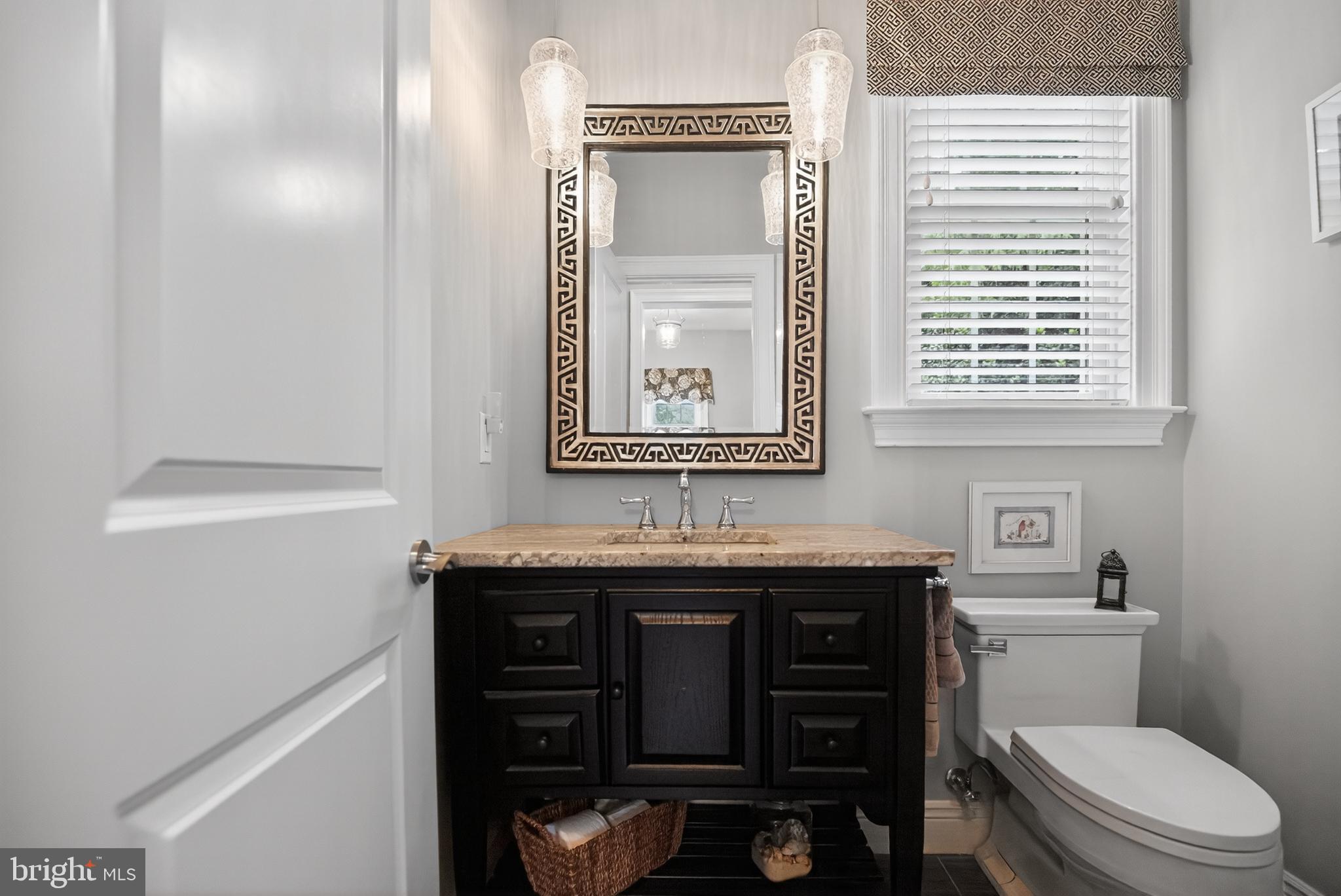 1031 Coates Road Jenkintown, PA 19046 - Photo 42 of 66 a bathroom with a toilet a sink and a window