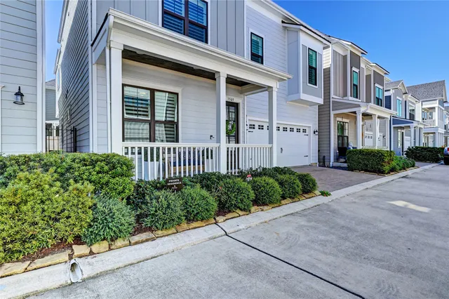 a view of a brick house with a yard