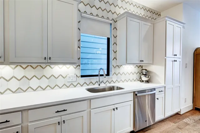 a very nice looking living room with wooden floor and furniture