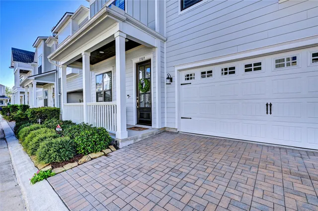 a view of a house with a white door and a yard