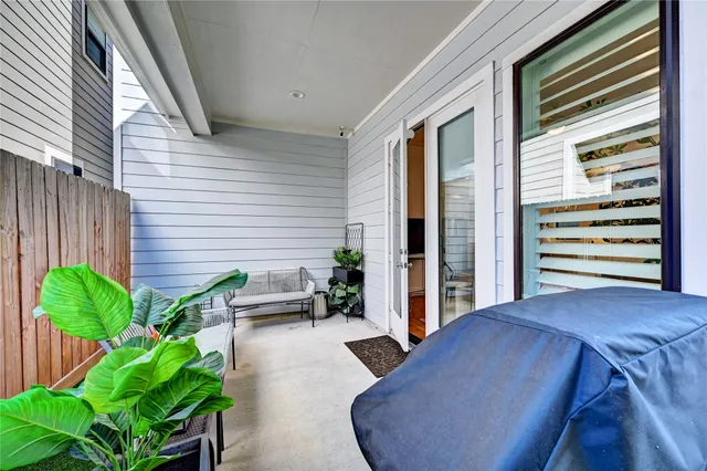 a view of entryway with wooden floor and stairs