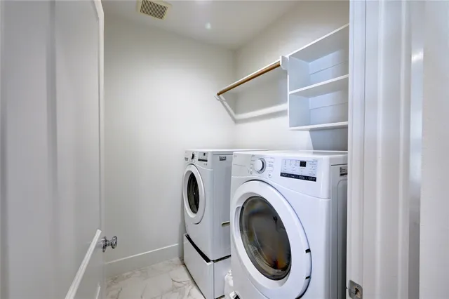a bathroom with a double vanity sink and mirror