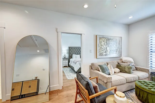 a bedroom with a beds and a potted plant