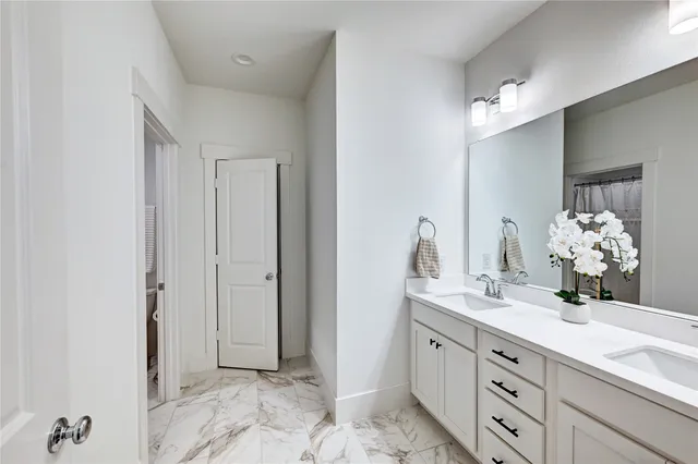 a bedroom with a bed and a chair