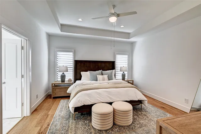 a view of a hallway with wooden floor and stairs