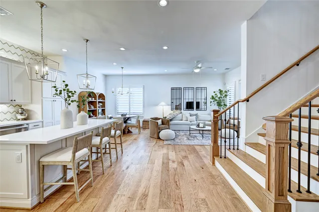 a kitchen with counter space dining table and stainless steel appliances