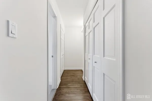 a bathroom with a sink a vanity and a large mirror
