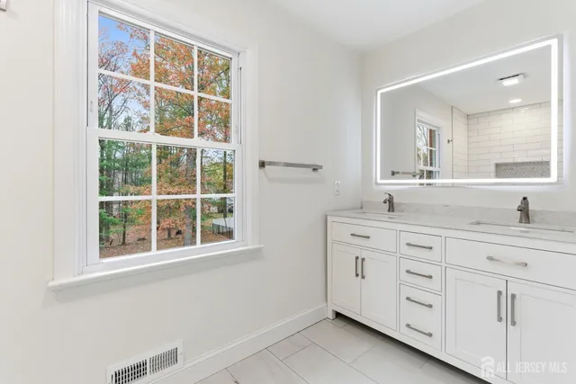 a bathroom with a bathtub and shower