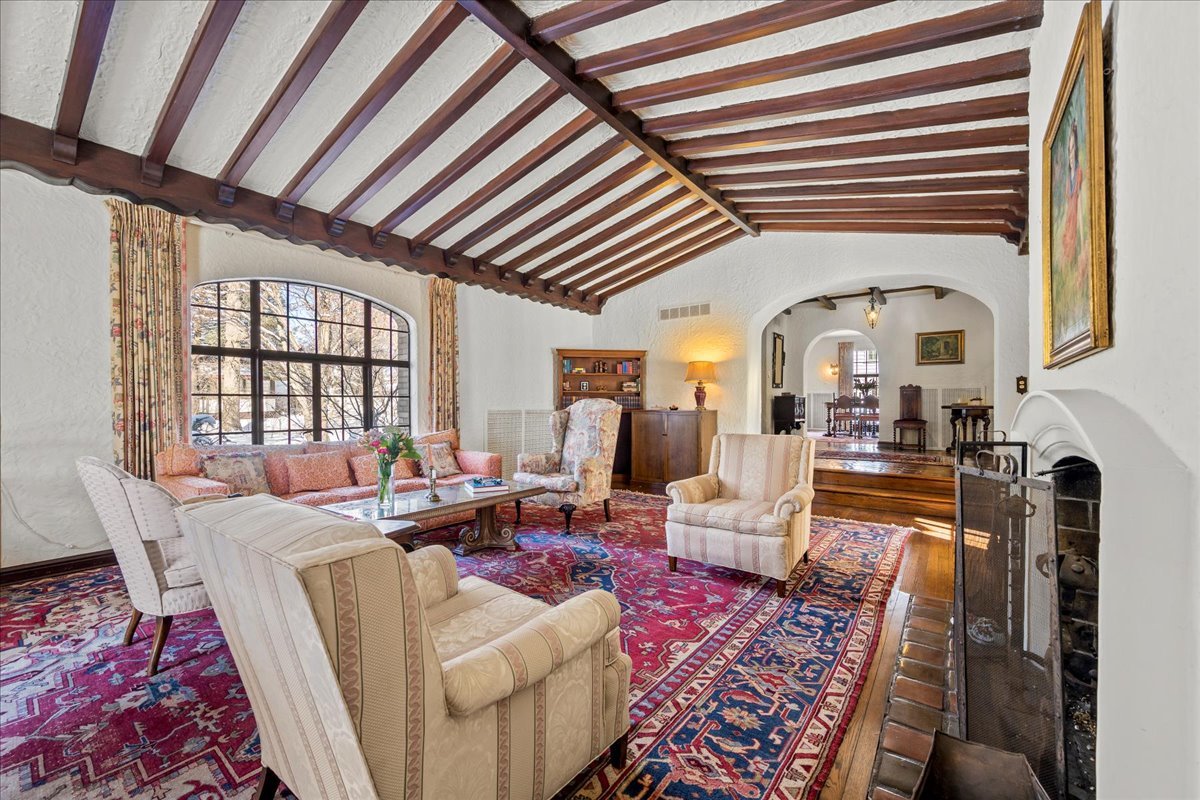 260 Oxford Road Kenilworth, IL 60043 - Photo 18 of 61 a living room with furniture fireplace and a large window
