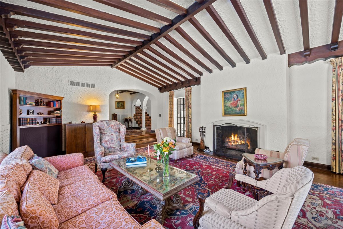 260 Oxford Road Kenilworth, IL 60043 - Photo 22 of 61 a living room with furniture and a fireplace