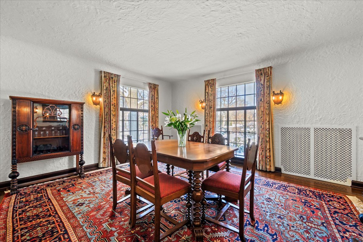 260 Oxford Road Kenilworth, IL 60043 - Photo 23 of 61 a dining room with furniture wooden floor and a rug