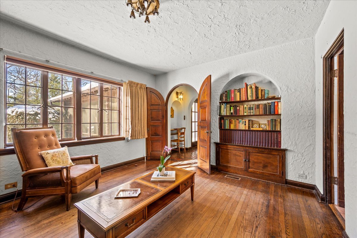 260 Oxford Road Kenilworth, IL 60043 - Photo 28 of 61 a living room with furniture a rug wooden floor and a window