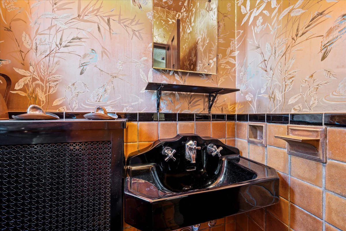 260 Oxford Road Kenilworth, IL 60043 - Photo 35 of 61 a kitchen with a sink and a stove next to a blue house